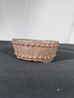 Nail-head rustic mame round, side view